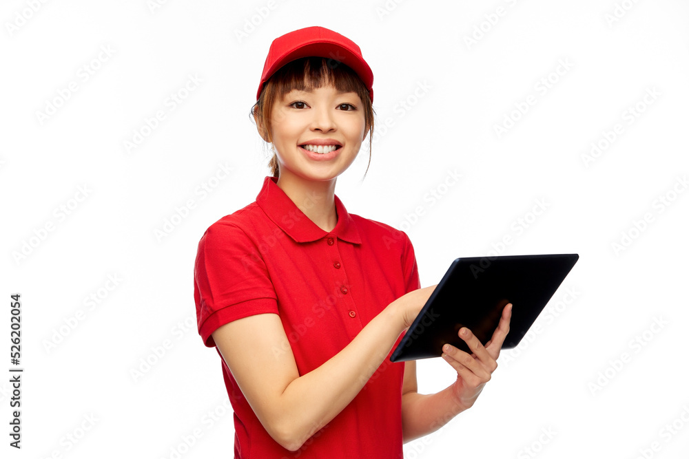 profession, job and people concept - happy smiling delivery woman in red uniform with tablet pc computer over white background profession, job and people concept - happy smiling delivery woman in red uniform with tablet pc computer over white background