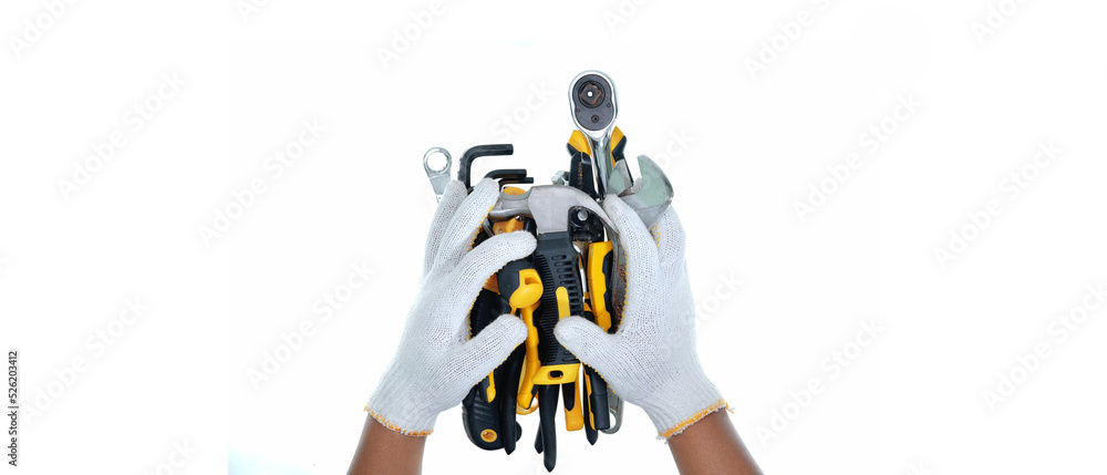 two hand wearing white gloves holding  different types hand tools isolated white background