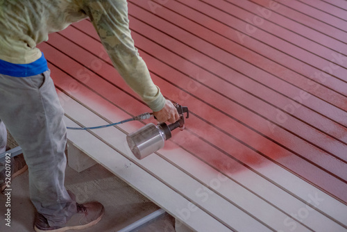 Professional painters are painting the interior of the house.