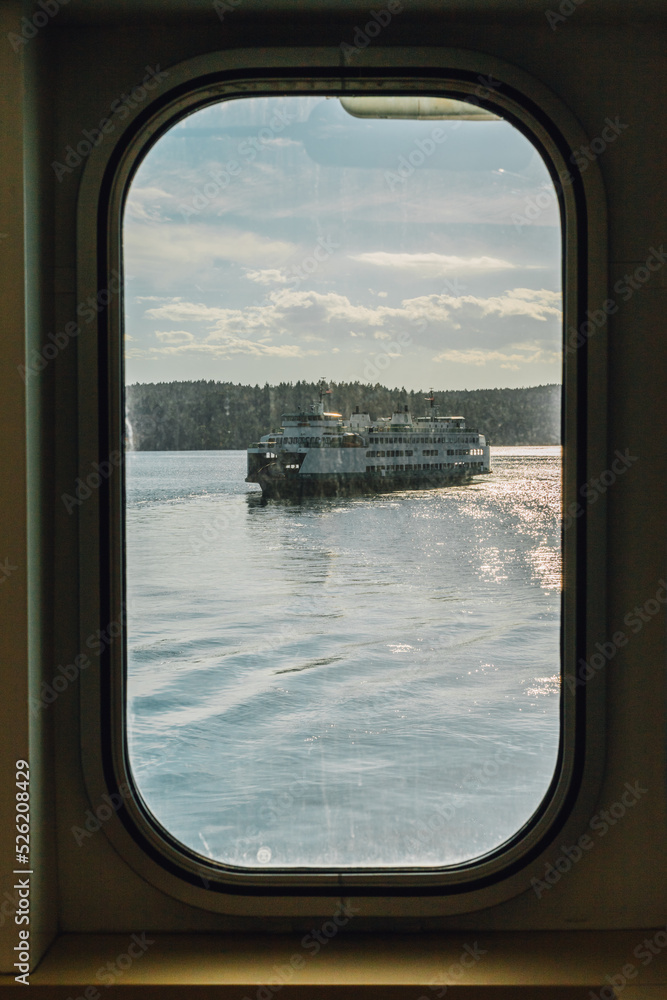 Viewing a ferry boat through a passing ferry boat window Viewing a ferry boat through a passing ferry boat window