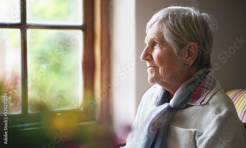 Canvastavla Happy elderly woman looking out window thinking of memories pensioner retirement
