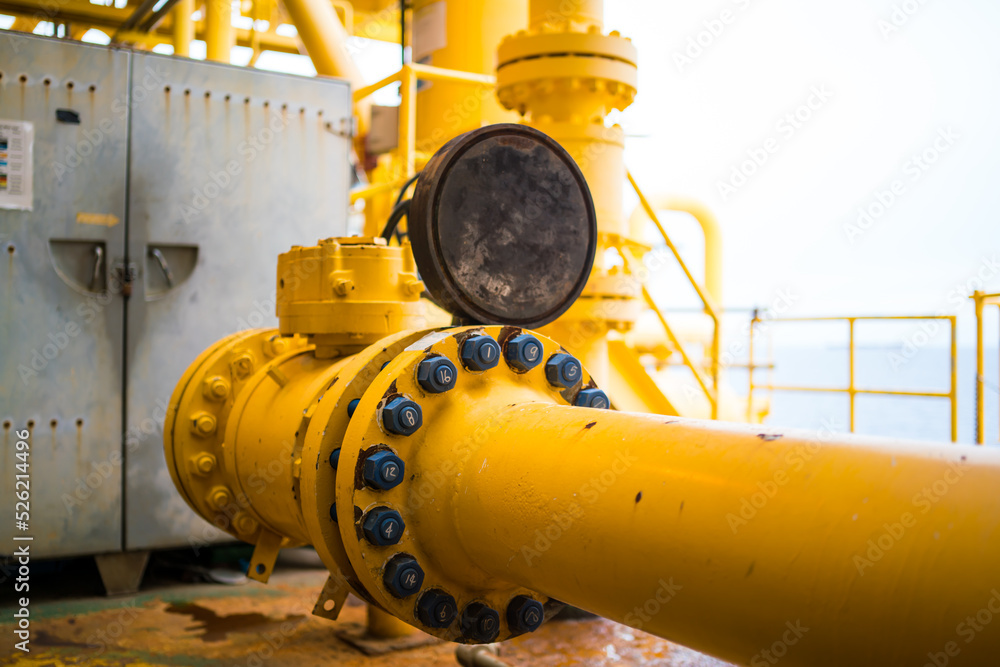 Oil and gas processing plant with pipe line valves.Steel pipelines and valves.Oil pipeline valves in the oil and gas industry. Oil and gas processing plant with pipe line valves.Steel pipelines and valves.Oil pipeline valves in the oil and gas industry.