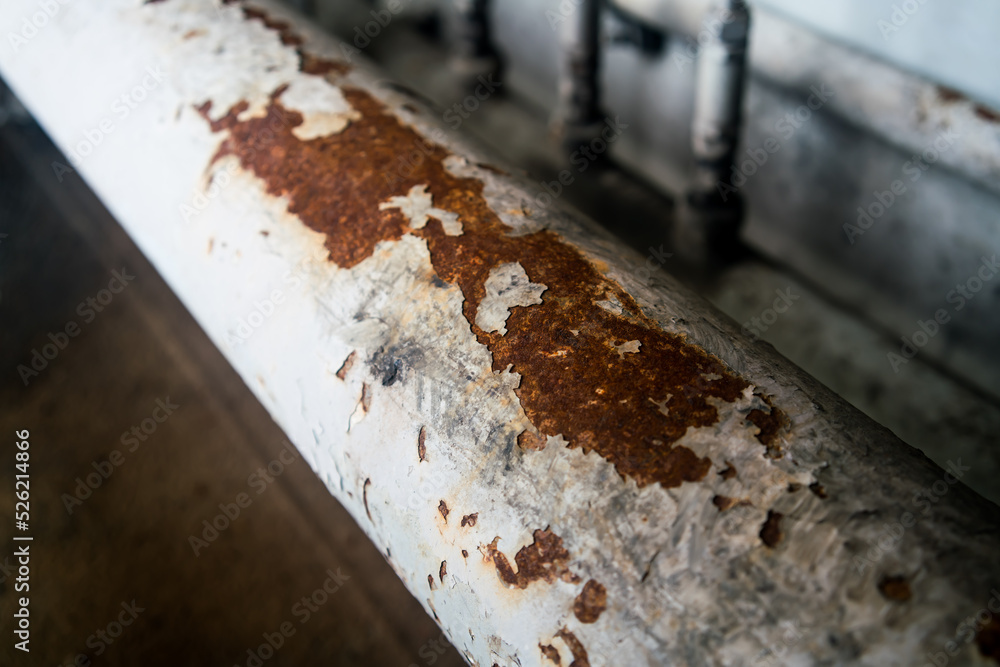 Steel pipe clamp with anti-rust paint peeling off the pipe surface. Steel pipe clamp with anti-rust paint peeling off the pipe surface.