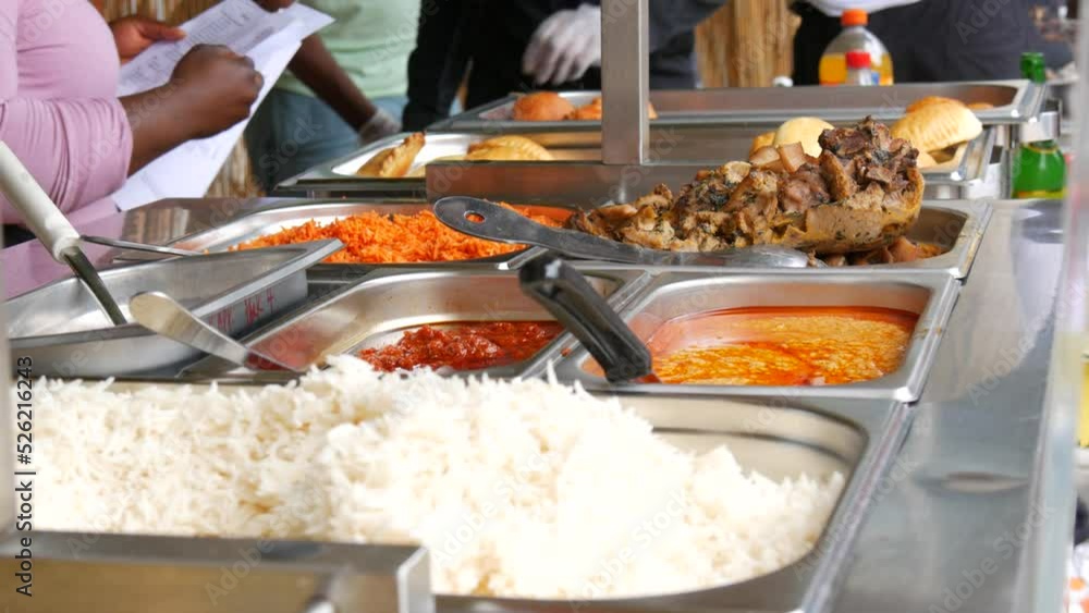 Showcase with traditional African food at a street food festival. Meat