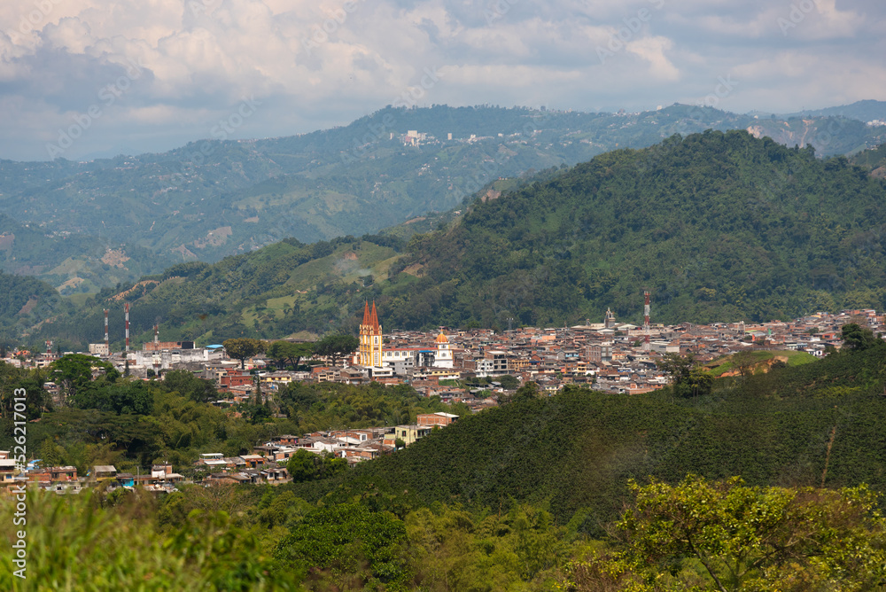 Panoramic view of a church in a country town between hills in Colombia