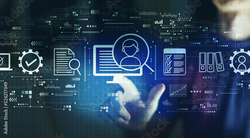 Document management system concept with young man touching a digital screen at night