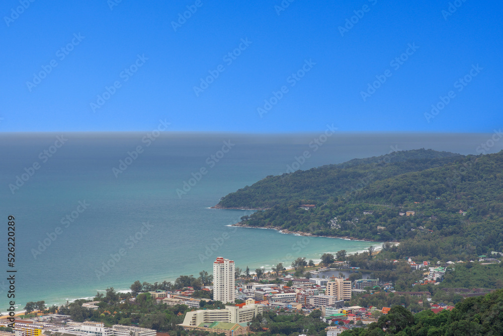 Karon Beach in Phuket Thailand, turquoise blue waters, lush green mountains colourful skies. Phuket is a tropical island many palms Karon Beach in Phuket Thailand, turquoise blue waters, lush green mountains colourful skies. Phuket is a tropical island many palms