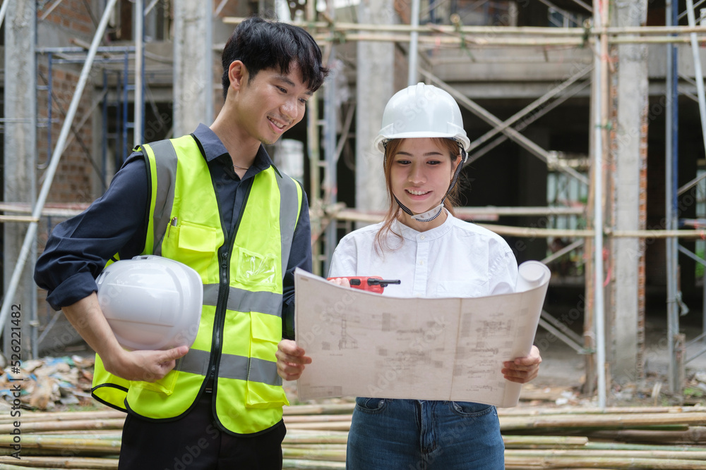 Shot of engineer discussing the structure of the building with architect at construction site. Shot of engineer discussing the structure of the building with architect at construction site.