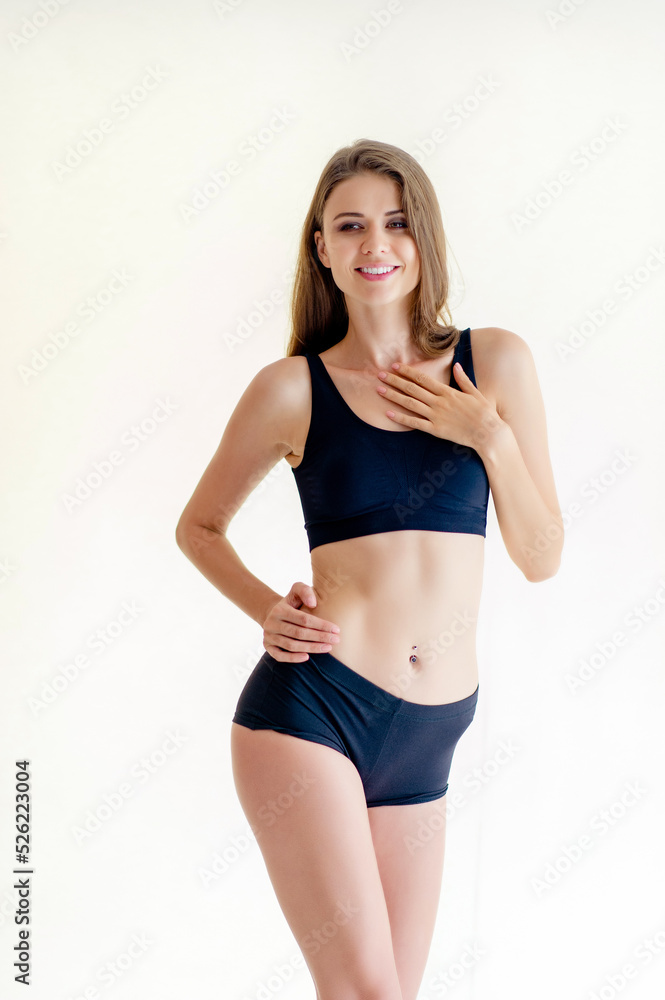 Fototapeta premium beautiful girl with a good figure wearing a corset fitness girl love health beauty A woman who is perfect in proportions of beauty and slender figure.