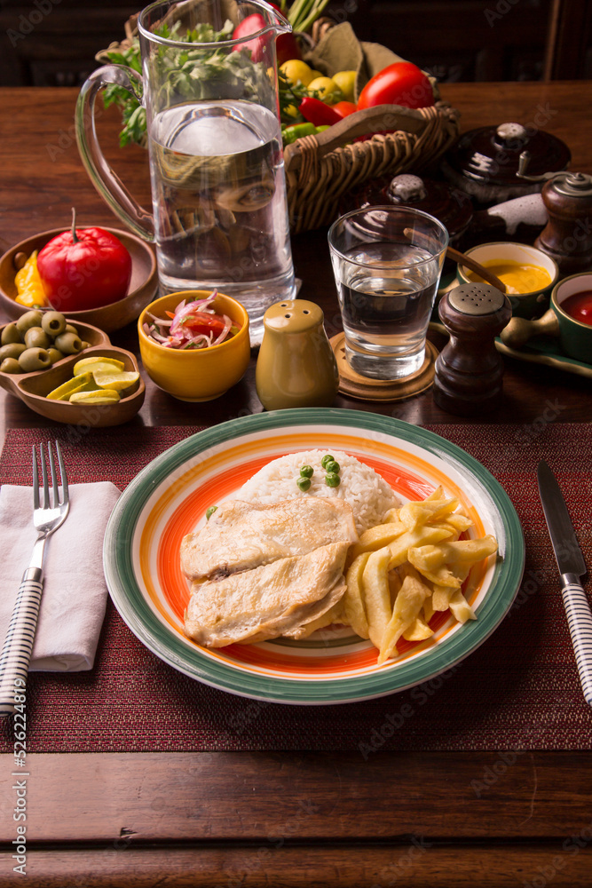 Fried chicken filet with french fries and rice peruvian gourmet restaurant comfort food Fried chicken filet with french fries and rice peruvian gourmet restaurant comfort food