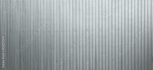 Galvanized metal sheet used to make fences in construction sites. A panoramic image of a metal sheet suitable for use as a background.