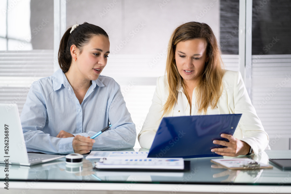 Two Businesspeople Analyzing Financial Graph Two Businesspeople Analyzing Financial Graph