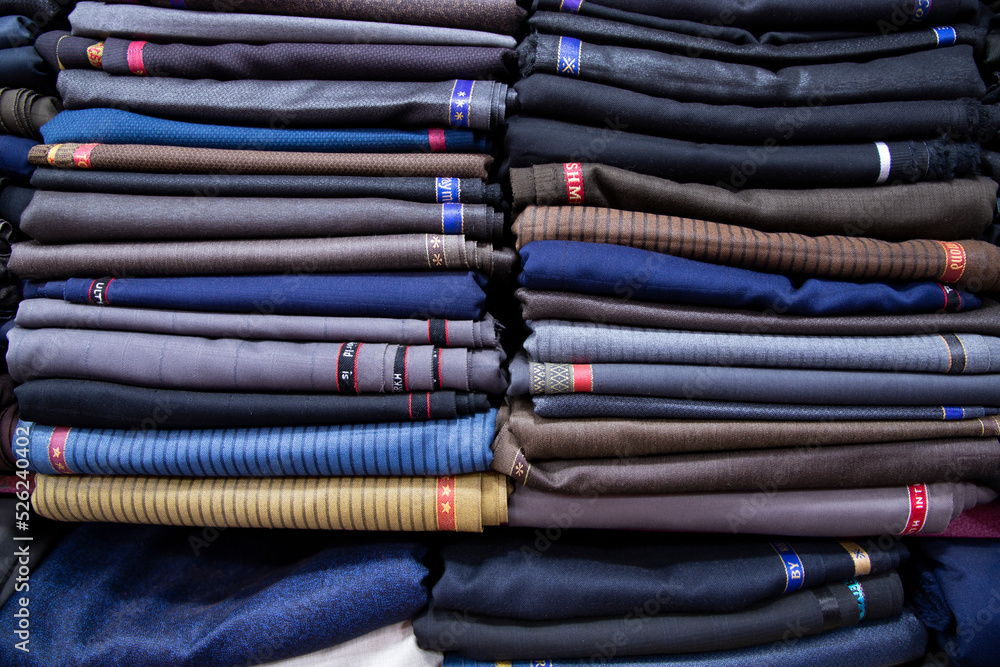 Patterned Textile Fabrics stacked on a retail Shop Shelf for sale Patterned Textile Fabrics stacked on a retail Shop Shelf for sale