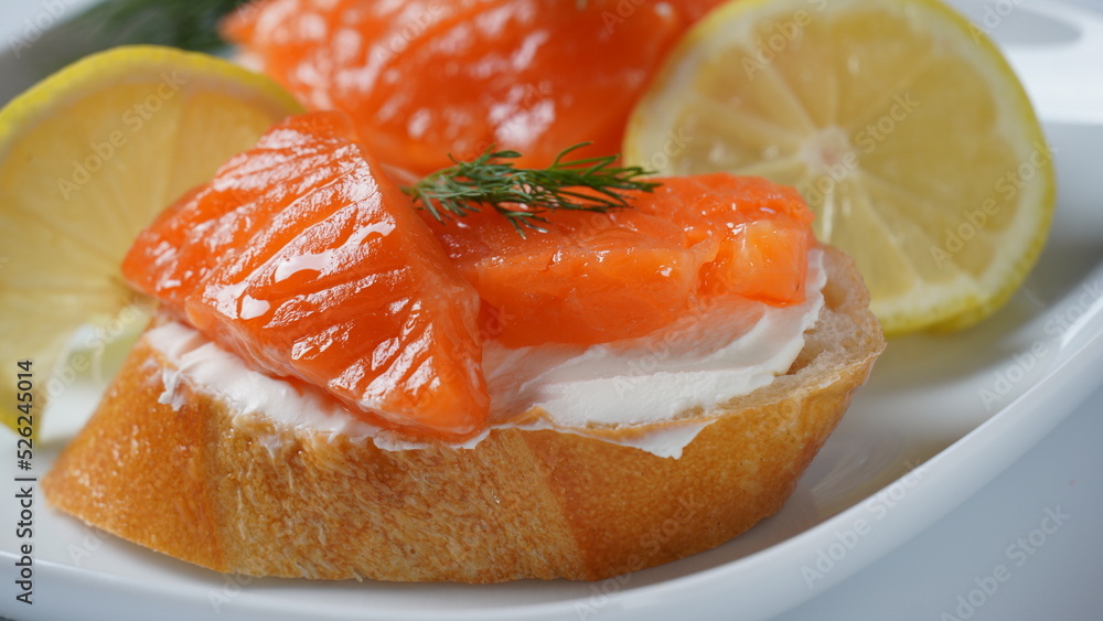 Open sandwiches with trout fillet ,wheat bread with butter and herbs Open sandwiches with trout fillet ,wheat bread with butter and herbs