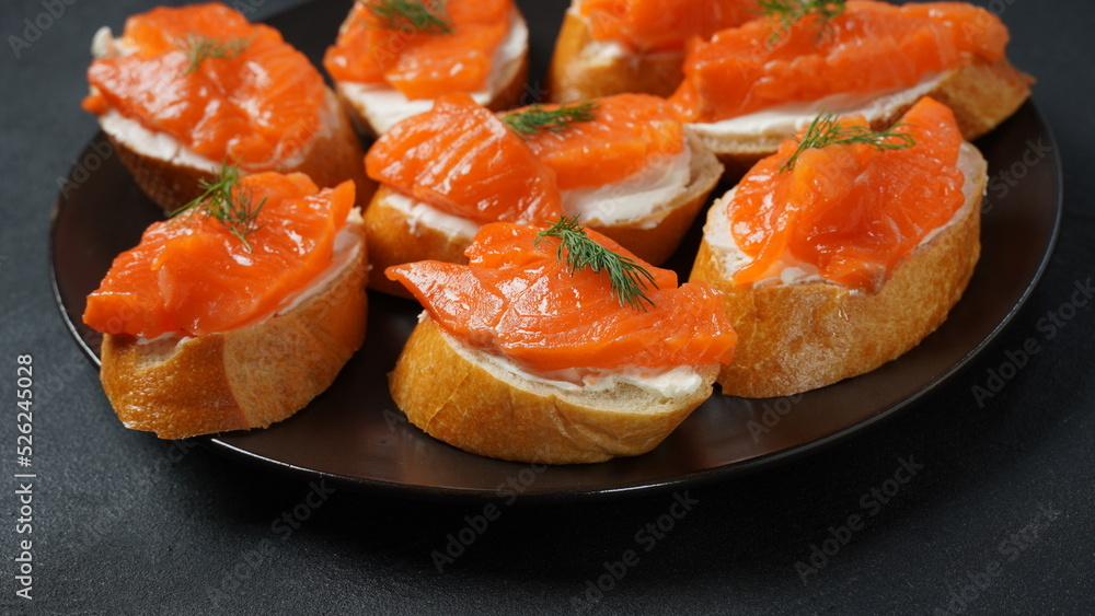 Open sandwiches with trout fillet ,wheat bread with butter and herbs