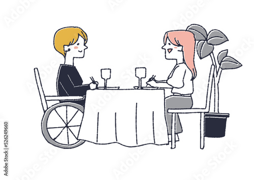 車椅子友人と一緒にレストランで食事を楽しむ女性　障害者を思いやる周りの人々や社会づくり