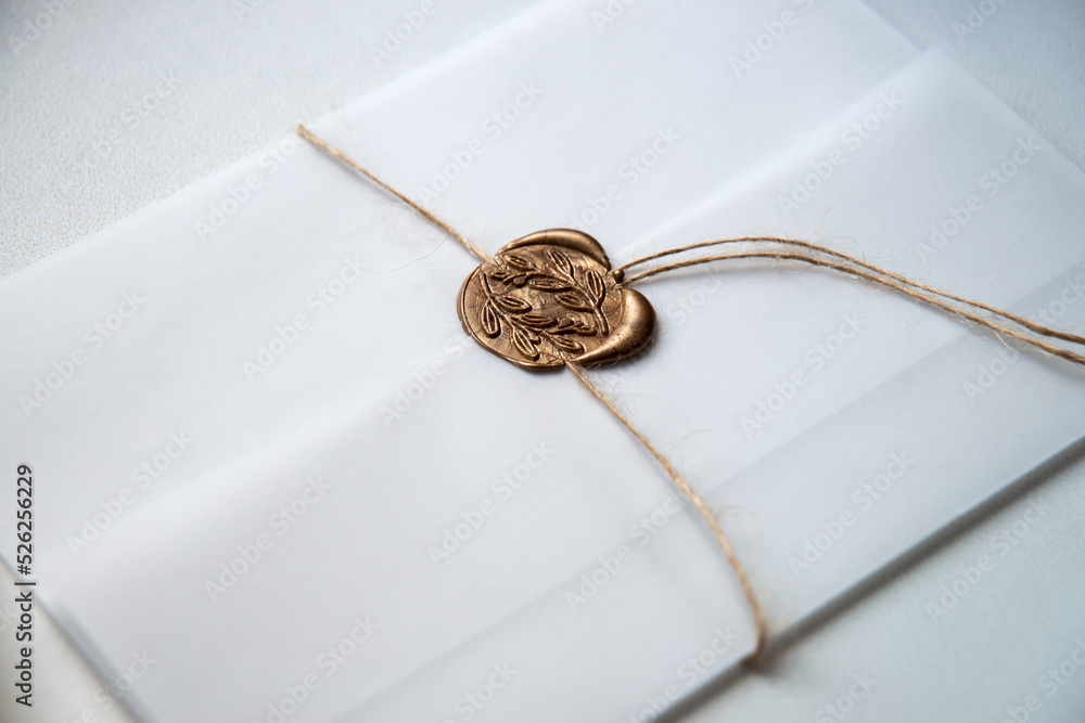 Fototapeta premium White envelope with a seal. Light background