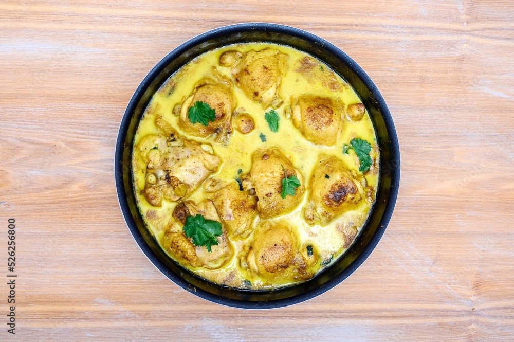 Fresh chicken tikka masala freshly cooked in a home kitchen close-up. Fresh chicken tikka masala freshly cooked in a home kitchen close-up.