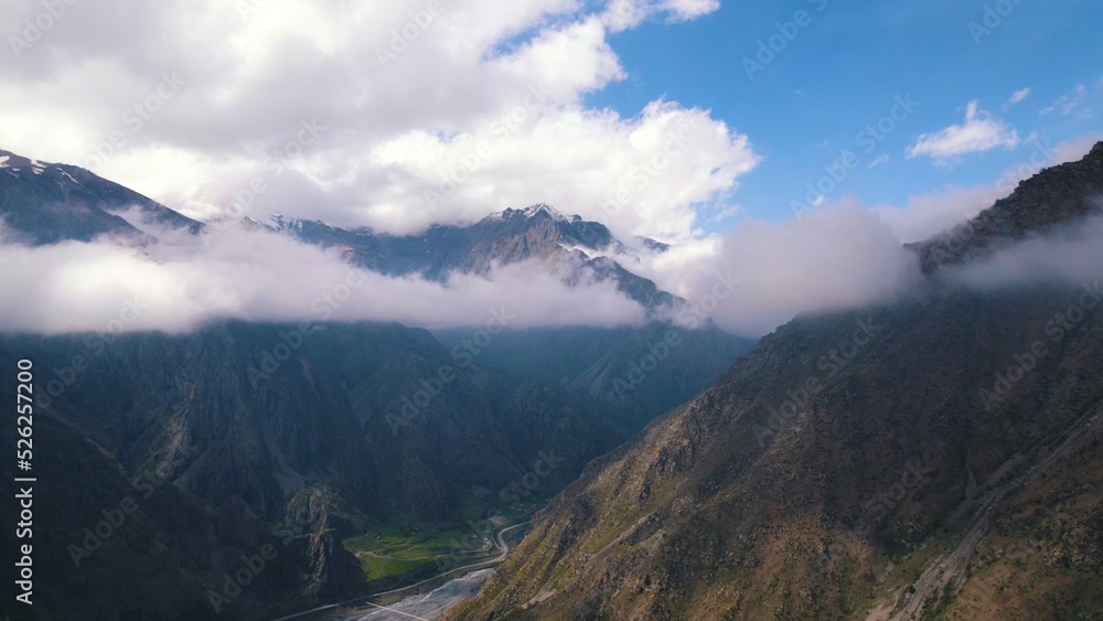 Fototapeta premium marvelous birds-eye view of Dariali gorge from the clouds, Kazbegi, Georgia. High quality photo