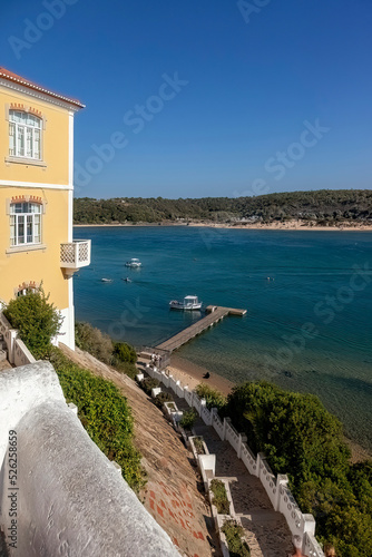 Breathtaking view of the mouth of the River Mira flowing into the Atlantic Ocean - Aquatic lifestyle sport in idyllic turquoise water, Vila Nova de Milfontes, Vicentine Coast Natural Park PORTUGA