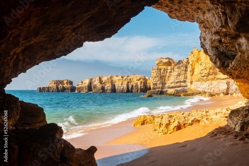 A natural summer beach cave at Praia da Coelha, Algarve, Albufeira. Portugal