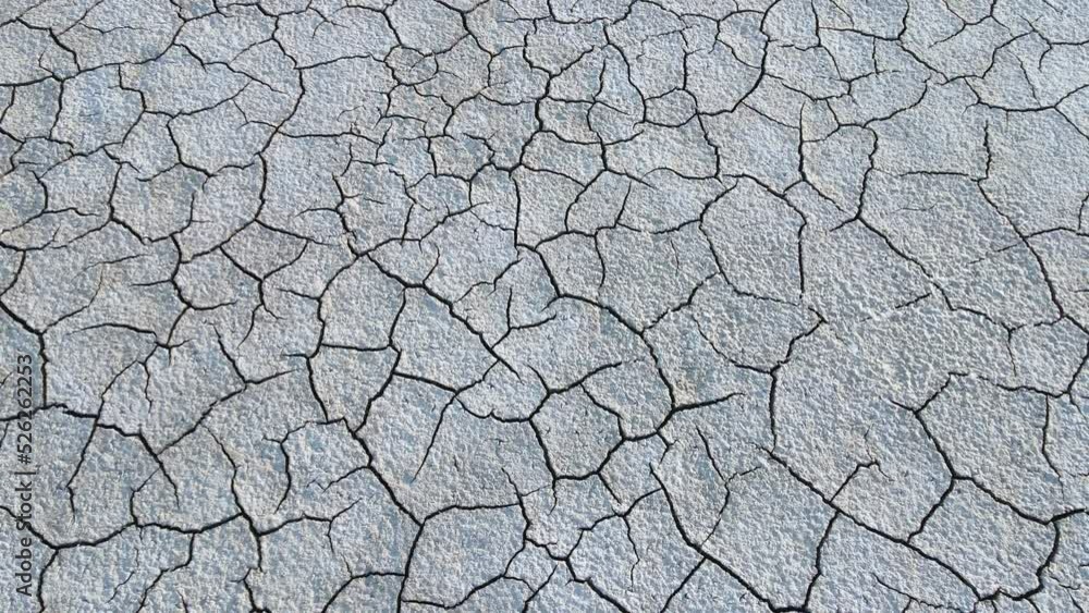 Geology.Dried-up riverbeds and lakes. Drought, global warming and climate change. Cracked dry earth and soil.Dry desert, drought season. Idea concept symbol disaster ecology in nature. Geology.Dried-up riverbeds and lakes. Drought, global warming and climate change. Cracked dry earth and soil.Dry desert, drought season. Idea concept symbol disaster ecology in nature.