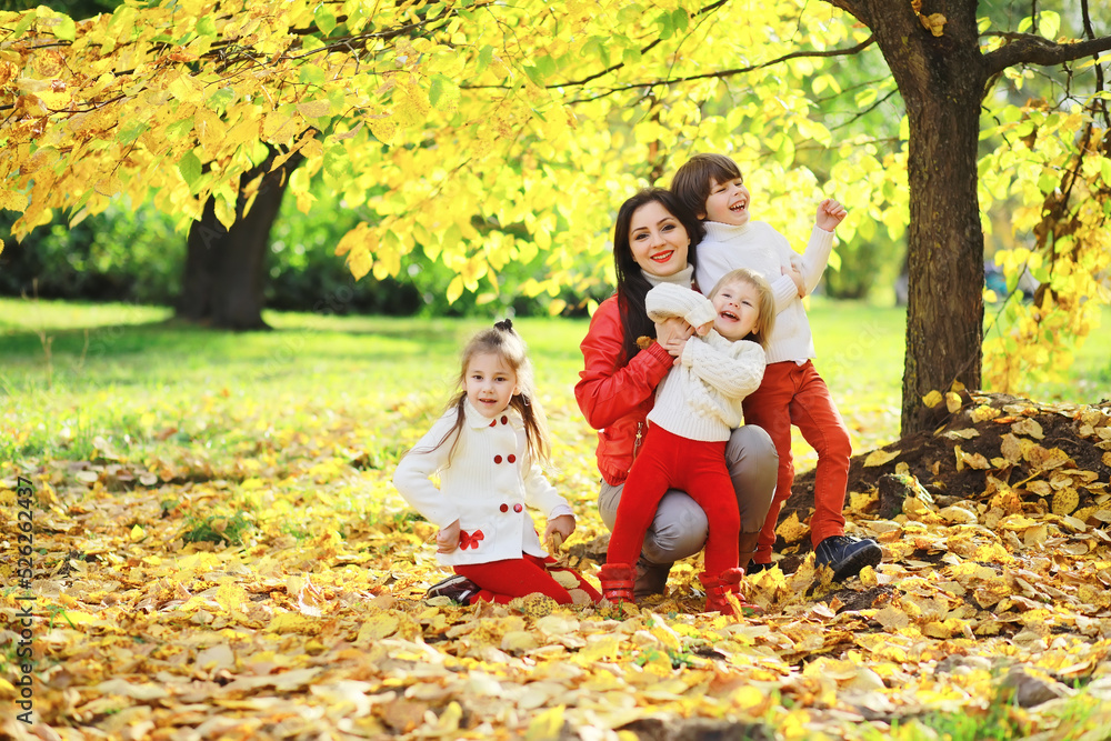Children for a walk in the autumn park. Leaf fall in the park. Family. Fall. Happiness. Children for a walk in the autumn park. Leaf fall in the park. Family. Fall. Happiness.