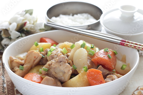 Asian food, braised chicken and potato with carrot on rice 