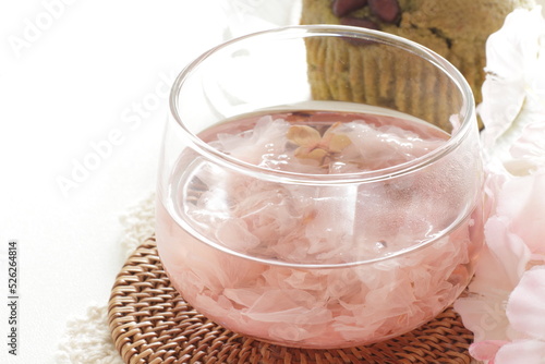 Japanese culture, Edible cherry blossom flower tea in glass cup