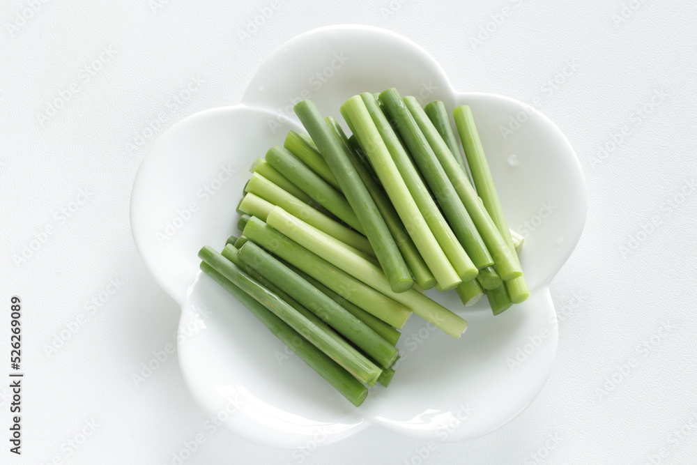 Prepared Chinese vegetable, garlic sprouts on white plate Prepared Chinese vegetable, garlic sprouts on white plate