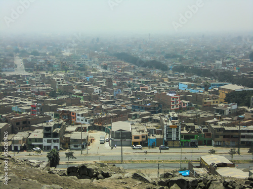 Houses of different construction materials in a low-income human settlement in Peru.