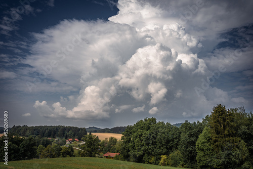 Storm cloud on the horizon. nature environment severe weather huge cloud in the sky stormy cloud. Bayern Germany.