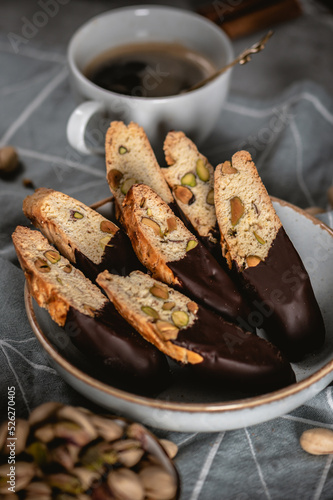 Fotografie Biscotti or cantuccini with nuts on dark background