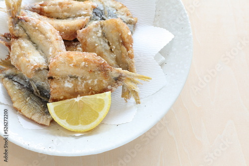 Japanese food, deep fried spotted sardine fish served with lemon