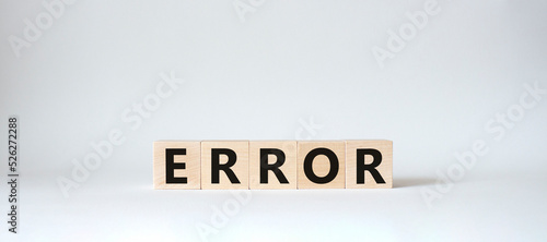 Error symbol. Wooden cubes with word Error. Beautiful white background. Error concept. Copy space.