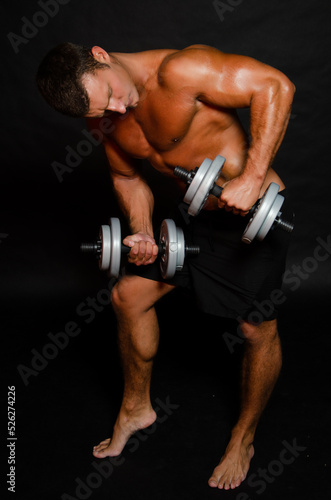 Young attractive man goes in for sports.