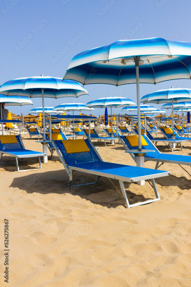 Traditional beach chair and umbrella. Rimini, Italy,