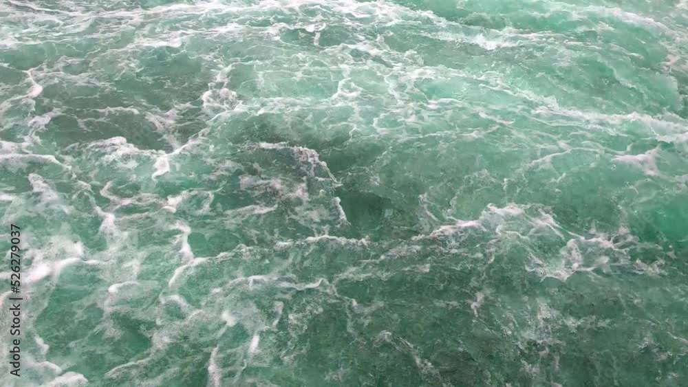 Top view of turquoise water. Large flow of water in a mountain river. Water splashes, splashes, foam, power Top view of turquoise water. Large flow of water in a mountain river. Water splashes, splashes, foam, power