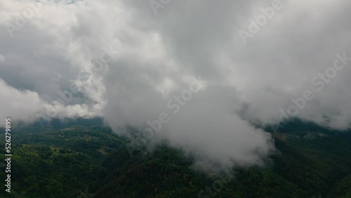 Aerial time lapse of fog over hills, after rain