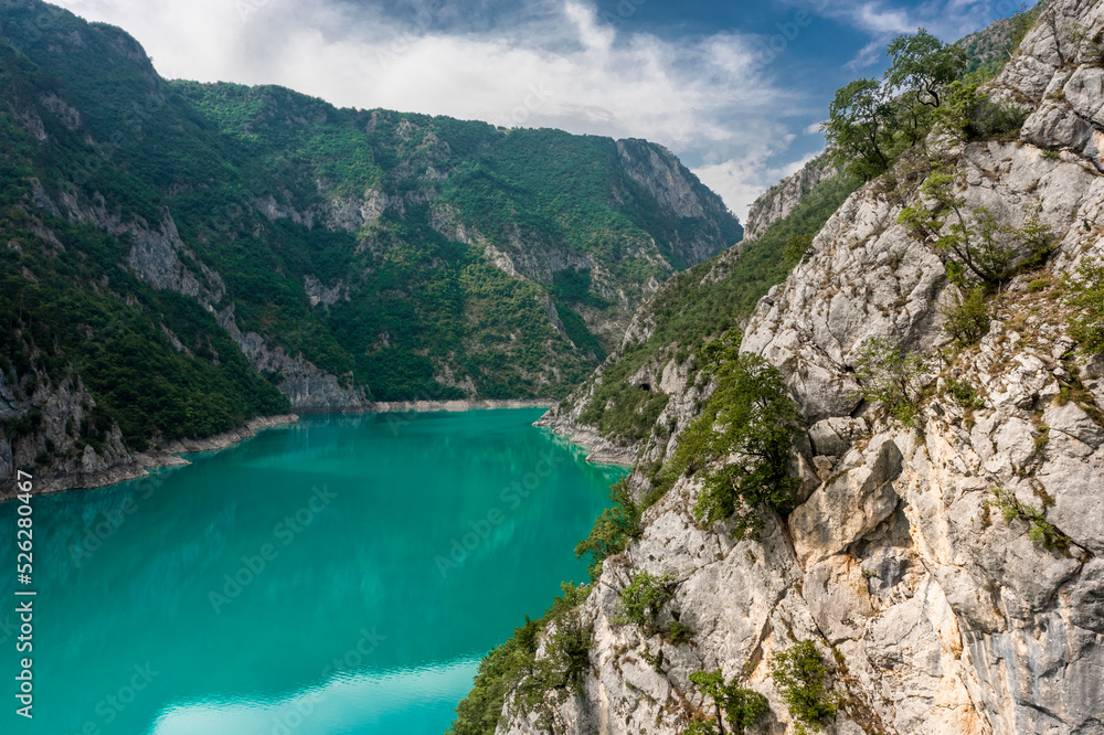 Piva Lake - Amazing Mountain View in Montenegro / Alps Landscape - turquoise blue water on Balkan between rocks