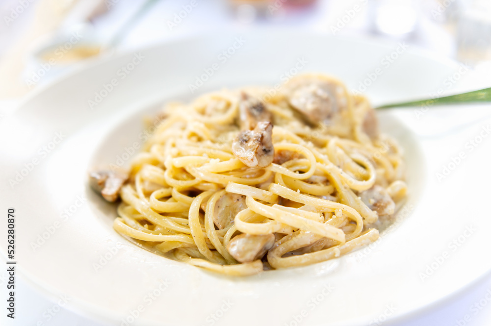 Creamy mushroom Spaghetti pasta, Vegan option, served in restaurant