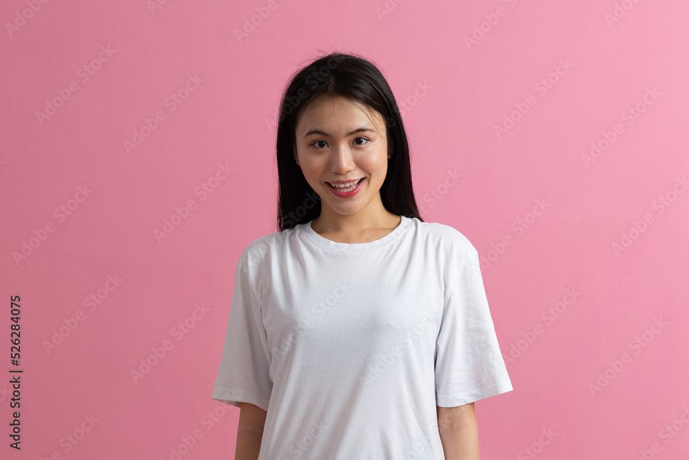 Portrait of asian positive smiling woman on pink background. Portrait of asian positive smiling woman on pink background.