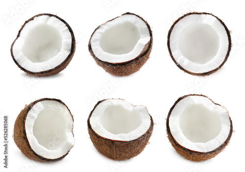 Set with halves of fresh ripe coconuts on white background