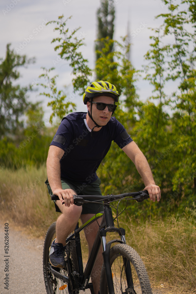 Obraz premium Portrait of blonde guy riding his bike