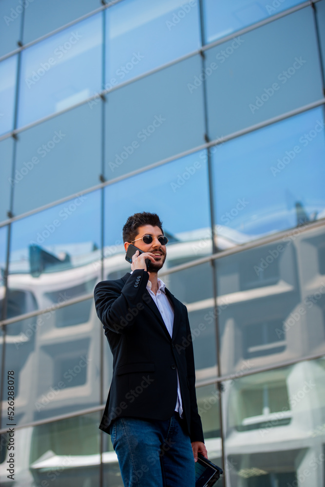 Businessman talking on his phone Businessman talking on his phone