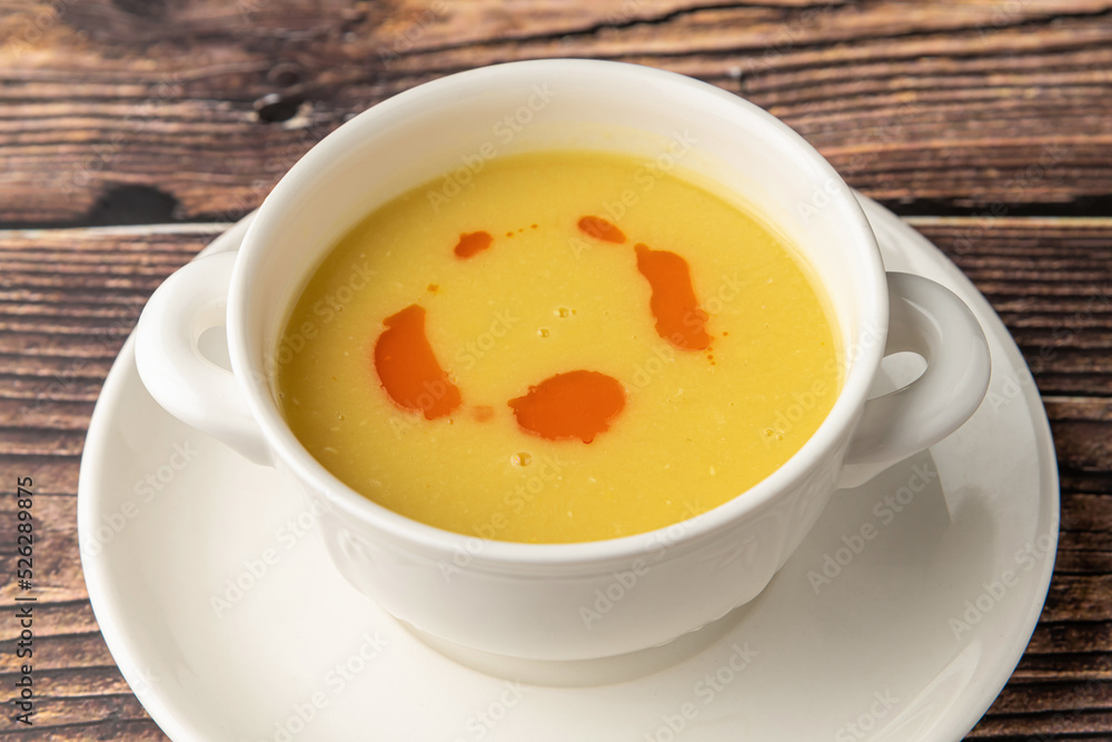 Strained lentil soup on a white porcelain plate Strained lentil soup on a white porcelain plate