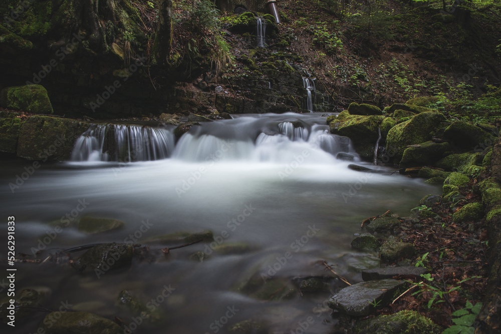 Fototapeta premium Famous Satiny waterfalls. Breathtaking, untouched nature around the water flowing down cascades creating mini waterfalls. Beskydy mountains, Czech republic, Central europe. Without human intervention