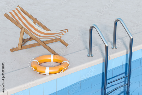 Sunbed and lifebuoy near pool with water