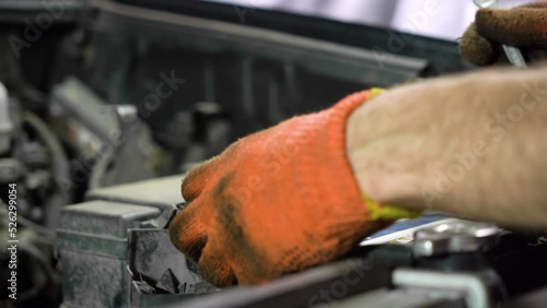 car battery replacement. close-up. auto repair shop.