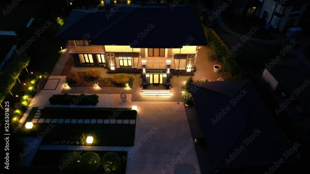 Night illumination of a country house from a drone Night illumination of a country house from a drone